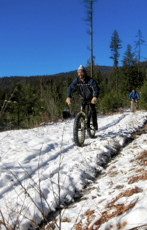 Biking over snow with fat tires.