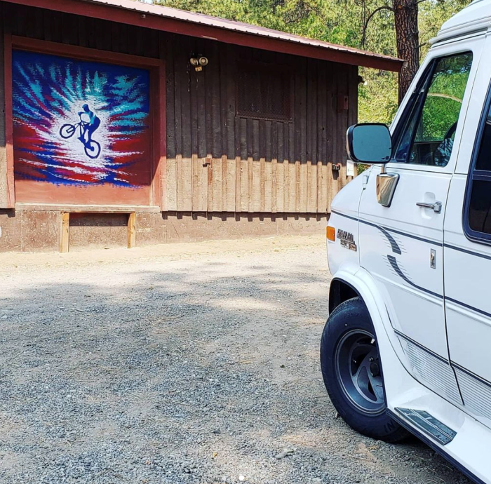 Spokane artist Christina Deubel's mobile art studio at Camp Sekani and her completed mural.