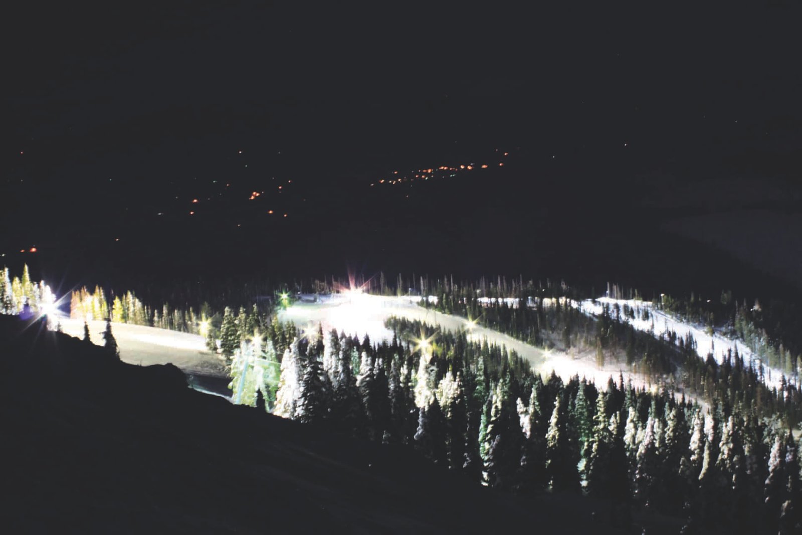 Photo of Mount Spokane all lit up at night from far away.