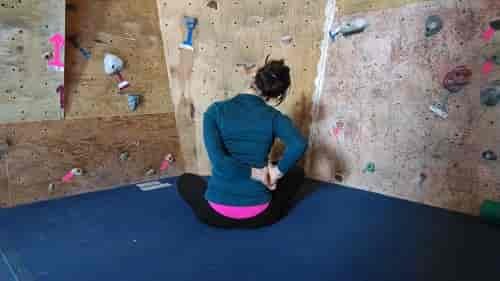Cross your legs, right leg on top, and take your left hand behind back to the small of your waist, clasping the right. Photo: Benjamin Zmuda