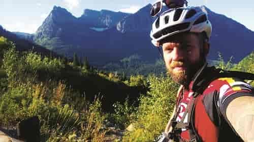 I rolled out of camp on Saturday morning a little after eight. There were blue skies, the sun was reflecting off the peaks, and I was finally on my bike. Photo: Simon Hartt