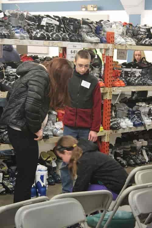 Make sure your kids are there so they can try on the boots and get the right fit. Photo courtesy of Winter Swap