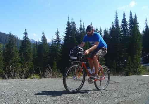 What kind of ride is a national forest ride? They are characterized by long days, fast riding on rough surfaces, lots of climbing, sketchy descents, and doing this while carrying a small load of food, water, supplies, and emergency camping gear. Photo courtesy of Josh Cohen/Elephant Bikes