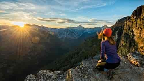 A hiker watches sunset over the Bitteroots from Bear Creek Overlook in the Selway-Bitterroot Wilderness.