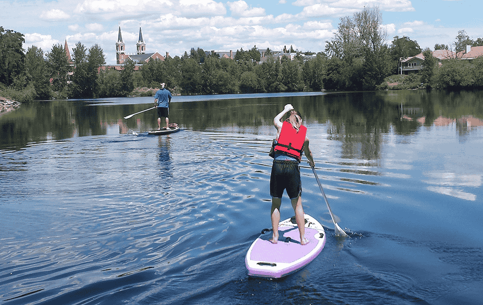 Photo of paddleboarders on the Spokane River by Cara Quien.