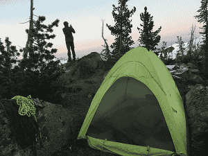 Photo of tent in alpine setting by Summer Hess.