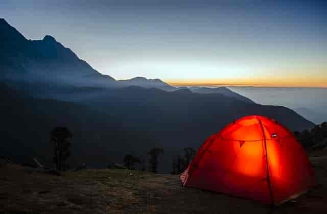 Tent in mountainous landscape.