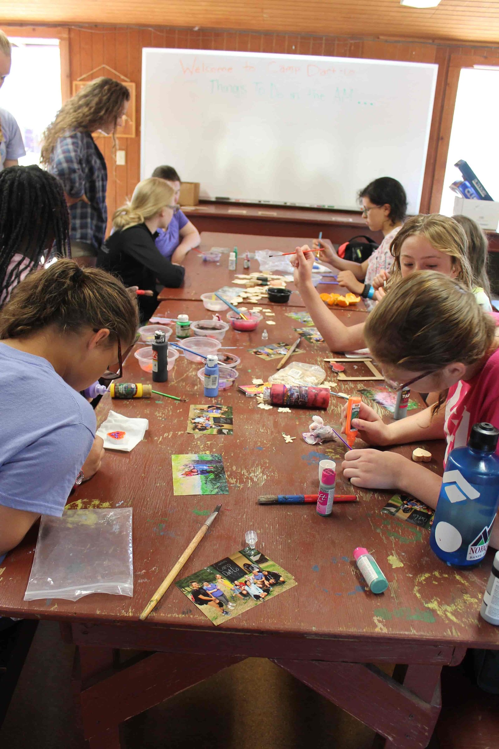 Kids do crafts at a camp table (Photo: Camp Fire Inland Northwest)