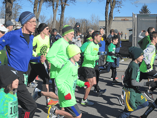 Photo of runners wearing green.