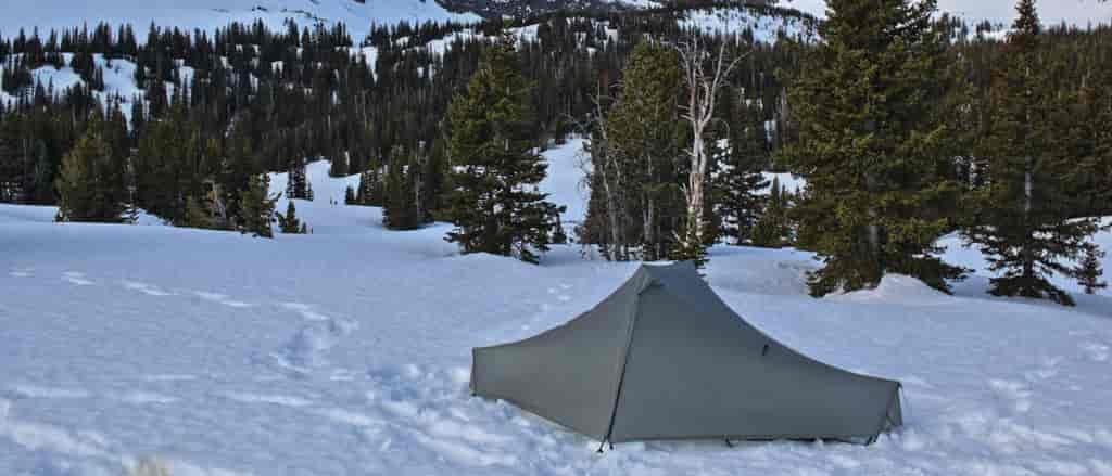 Photo of tent set up in snow on Mount Chisholm.