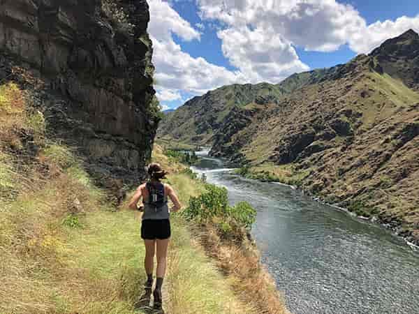 Runner on a trail above the Snake River.