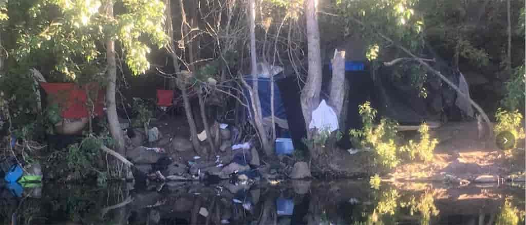 Photo of trash along the Spokane River shoreline.