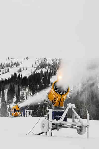 Photo of snowmakers blowing out wet snow at Schweitzer.