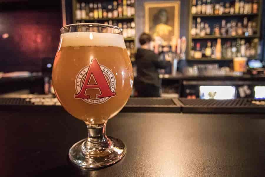 Close up photo of a beer in a glass on the bar at Berserk.