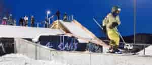 Photo of skier on rail.