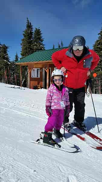 Photo of Doug and his granddaughter, Gabby on skis.