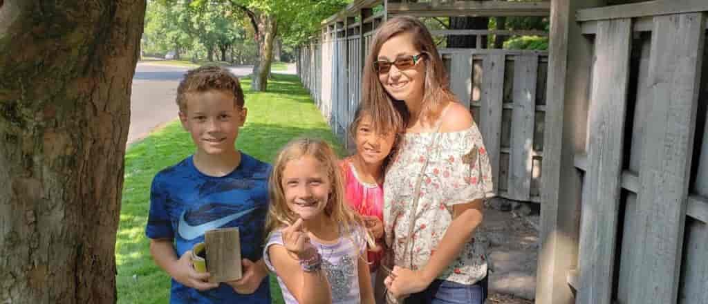 Portrait of family with Geocache find.