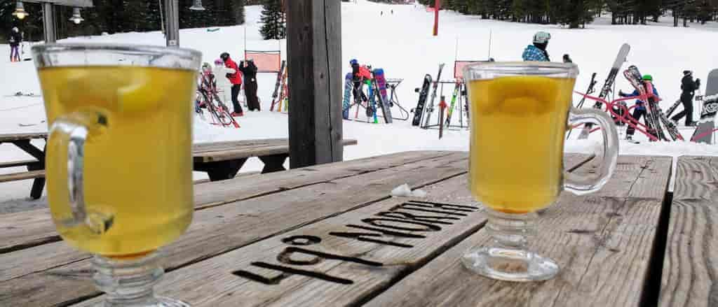 Photo of two Hot Toddies on a picnic table at 49 Degrees North.