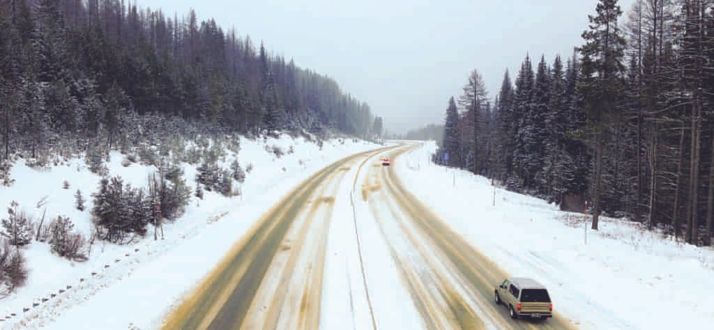View of a snowy interstate-90 from the overpass at Lookout Pass.