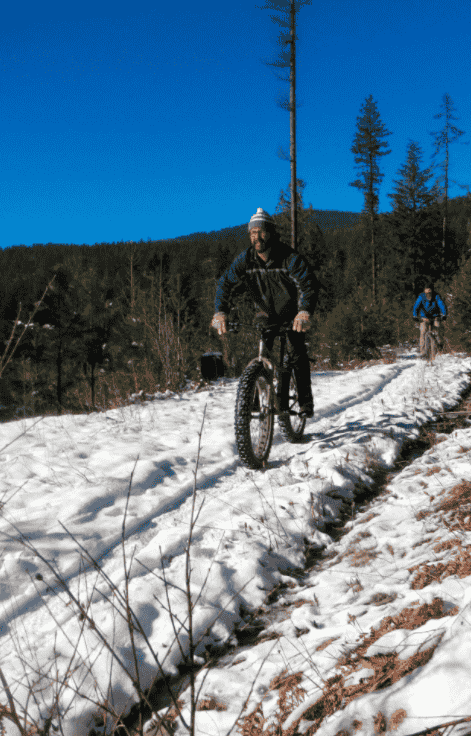 Biking over snow with fat tires.