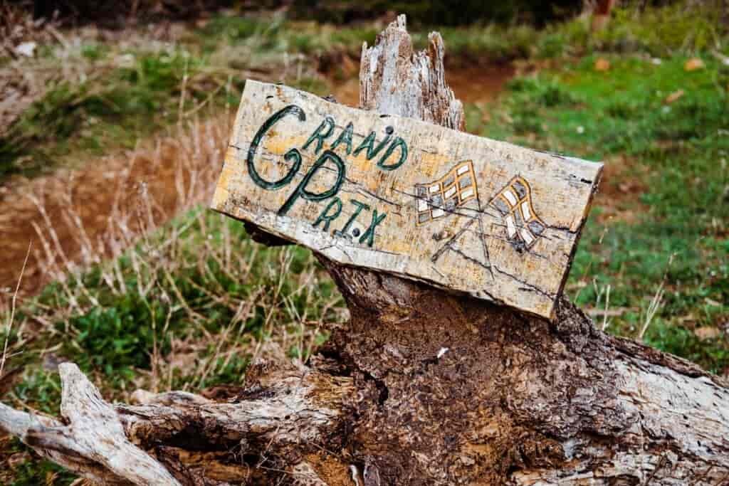Trail signs on stumps remind riders that Post Canyon is a working timber farm.